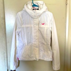Hollister Hooded Jacket in White with pink zipper, logo, and snap closure 💕